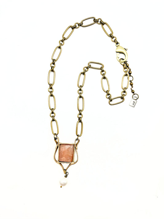 Hydna of scione- rose cut peach sunstone set in bronze harp inspired pendant